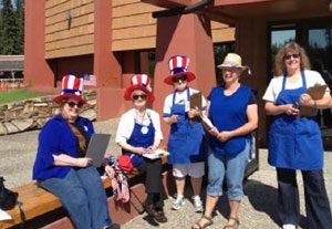 Image of LWVTV volunteers at Pioneer Park wearing Uncle Sam hats